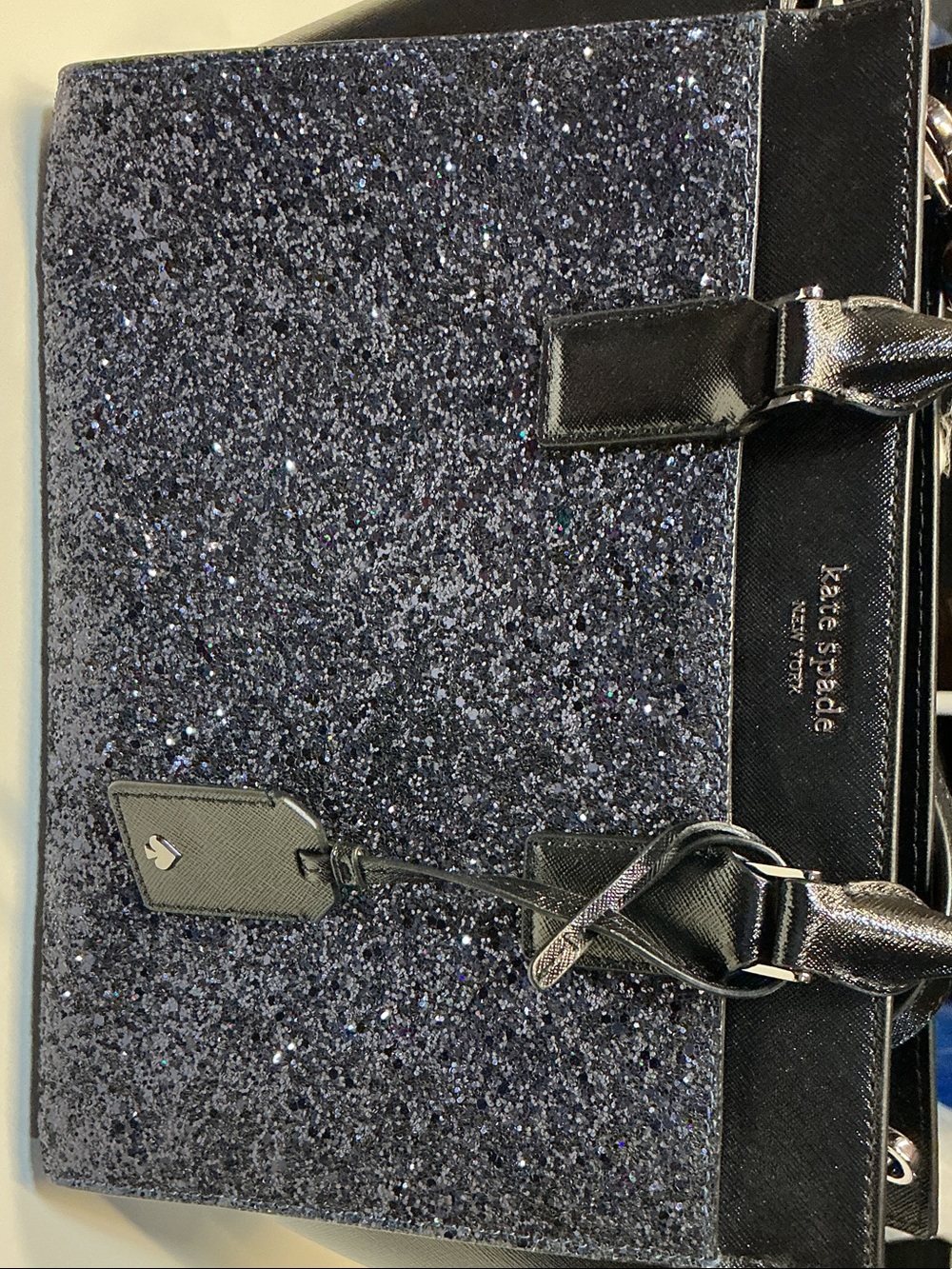 kate spade navy glitter tote with black trim and bow